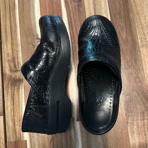 Dansko tooled leather clogs
